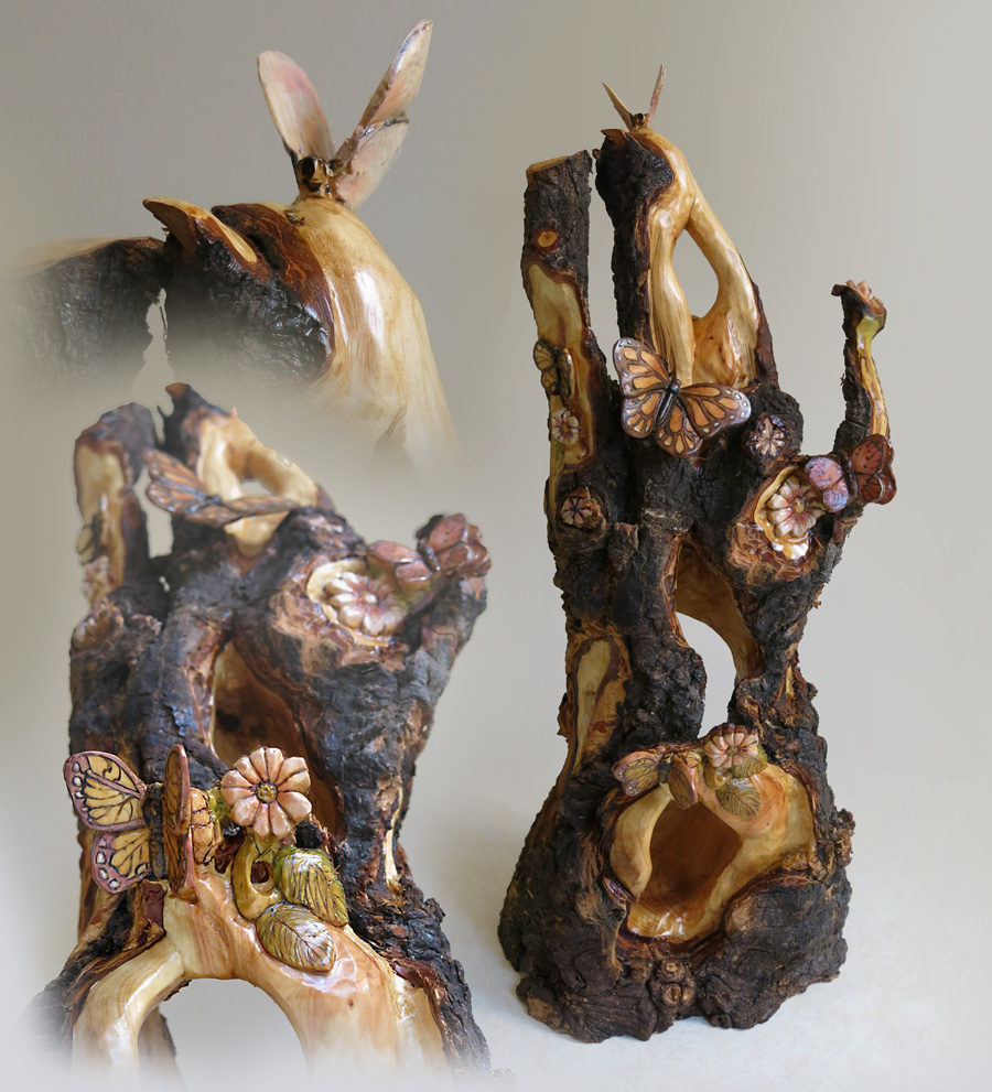 fairy house of hollowed out douglas fir with butterflies