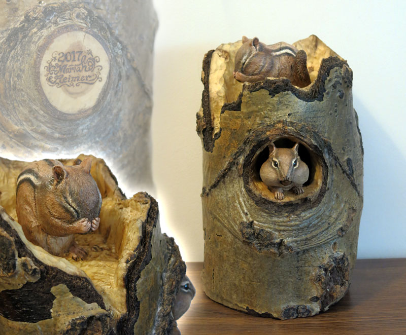 two chipmunks carved into short poplar stump