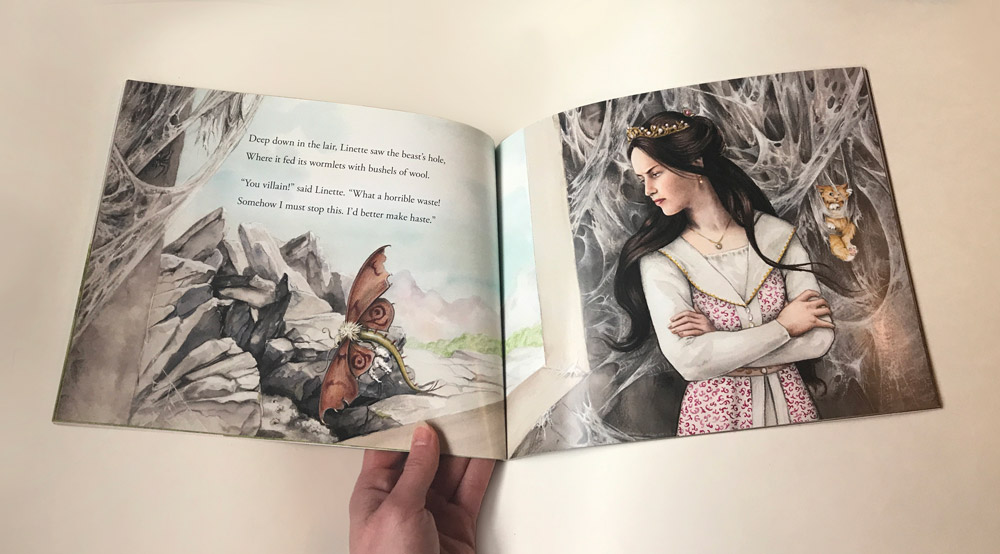 photo of the princess looking out of the tower window at the moth dragon book spread